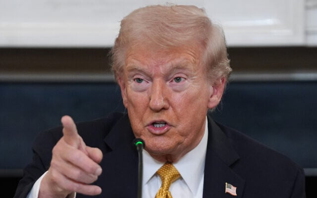 US President Donald Trump answers questions from reporters during a roundtable on criminal cartels in the State Dining Room of the White House, October 23, 2025, in Washington. (AP/Evan Vucci)
